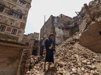 Yemeni men inspect the damage on the site of a collapsed UNESCO-listed building following heavy rains, in the old city of the Yemeni capital Sanaa, on August 12, 2020. Flash floods triggered by torrential rains have killed at least 172 people across Yemen over the past month, damaging homes and UNESCO-listed world heritage sites, officials said. Mohammed HUWAIS / AFP