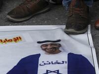 Palestinian refugees tread on a picture of Abu Dhabi Crown Prince Sheikh Mohammed bin Zayed Al Nahyan, during a demonstration against the Emirati-Israeli agreement in the Lebanese southern coastal city of Tyre, on August 15, 2020. Mahmoud ZAYYAT / AFP