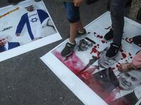Palestinian refugees tread on pictures of Abu Dhabi Crown Prince Sheikh Mohammed bin Zayed Al Nahyan, US President Donald Trump, and Israeli Prime Minister Benjamin Netanyahu, during a demonstration against the Emirati-Israeli agreement in the Lebanese southern coastal city of Tyre, on August 15, 2020. Mahmoud ZAYYAT / AFP