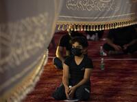 Iraqis respect social distancing at a mosque on August 20, 2020, as Muslim Shiites start marking Ashura under new health guidelines to limit the risk of exposure to Covid-19 virus. Hussein FALEH / AFP