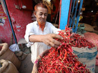 Market vendor sells chilies in the market on the riverbank of the Buriganga River on January 26, 2018 in Dhaka, Bangladesh. (Shutterstock/ File photo)
