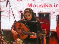 Noushin Yousefzadeh, oud player of the Iranian all-women music band "Dingo" performs with other band members at a concert during the state-organised "Persian Gulf music" festival at Avini Hall in Iran's southern Gulf port city of Bandar Abbas on April 29, 2019. ATTA KENARE / AFP
