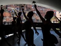 The 200 ballet students of Paraisopolis, the second largest favela in Sao Paulo, restarted rehearsals after five months with a coreography about a police operation that put their community in mourning last year. NELSON ALMEIDA / AFP