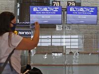 A picture taken on August 31, 2020, shows a passenger taking a picture of screens displaying the flight number of the first-ever commercial flight from Israel to the UAE at the Ben Gurion Airport near Tel Aviv, which will carry a US-Israeli delegation to the UAE following a normalisation accord. JACK GUEZ / AFP