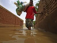Officials say that across Sudan seasonal floods have killed 94 people, injured 46 and destroyed or damaged over 60,000 homes, with the river level rising to 17.43 metres (57 feet feet). ASHRAF SHAZLY / AFP