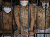 Gang members remain in an overcrowded cell at the Quezaltepeque prison, in Quezaltepeque, El Salvador, on September 4, 2020. Authorities from the General Directorate of Penal Centres (DGCP) visited three Salvadorean prisons, some of maximum security, to check the situation of inmates and carry out searches amid the COVID-19 novel coronavirus pandemic. Yuri CORTEZ / AFP