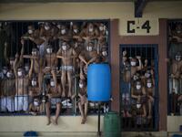 Members of the MS-13 and 18 gangs remain in an overcrowded cell at the Quezaltepeque prison, in Quezaltepeque, El Salvador, on September 4, 2020. Authorities from the General Directorate of Penal Centres (DGCP) visited three Salvadorean prisons, some of maximum security, to check the situation of inmates and carry out searches amid the COVID-19 novel coronavirus pandemic. Yuri CORTEZ / AFP