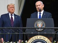 US President Donald Trump watches as Israeli Prime Minister Benjamin Netanyahu (R) speaks from the Truman Balcony at the White House during the signing ceremony of the Abraham Accords where the countries of Bahrain and the United Arab Emirates recognize Israel, on the South Lawn of the White House in Washington, DC, September 15, 2020. 