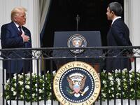 US President Donald Trump puts his hand over his heart as UAE Foreign Minister Abdullah bin Zayed Al-Nahyan (R) speaks from the Truman Balcony at the White House during the signing ceremony of the Abraham Accords where the countries of Bahrain and the United Arab Emirates recognize Israel, on the South Lawn of the White House in Washington, DC, September 15, 2020. 