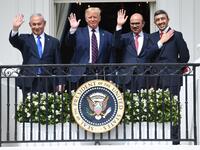 (L-R) Israeli Prime Minister Benjamin Netanyahu, US President Donald Trump, Bahrain Foreign Minister Abdullatif al-Zayani, and UAE Foreign Minister Abdullah bin Zayed Al-Nahyan wave from the Truman Balcony at the White House after they participated in the signing of the Abraham Accords where the countries of Bahrain and the United Arab Emirates recognize Israel, in Washington, DC, September 15, 2020. 