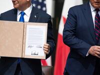 Israeli Prime Minister Benjamin Netanyahu(L) holds up the document after participating in the signing of the Abraham Accords where the countries of Bahrain and the United Arab Emirates recognize Israel, at the White House in Washington, DC, September 15, 2020. Israeli Prime Minister Benjamin Netanyahu and the foreign ministers of Bahrain and the United Arab Emirates arrived September 15, 2020 at the White House to sign historic accords normalizing ties between the Jewish and Arab states. SAUL LOEB / AFP