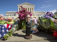A bobblehead of US Supreme Court Justice Ruth Bader Ginsburg is left outside of the US Supreme Court in Washington, DC, on September 19, 2020. Ginsburg died September 18, opening a crucial vacancy on the high court expected to set off a pitched political battle at the peak of the presidential campaign. Jose Luis Magana / AFP