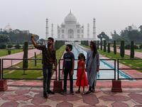 Tourists visit the Taj Mahal in Agra on September 21, 2020. The Taj Mahal reopened to visitors on September 21 in a symbolic business-as-usual gesture even as India looks set to overtake the US as the global leader in coronavirus infections. Sajjad HUSSAIN / AFP