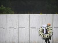 A US Park Ranger moves a memorial wreath prior to President Donald J. Trump delivering remarks at the Flight 93 National Memorial commemorating the 17th Anniversary of the crash of Flight 93 and the September 11th terrorist attacks on September 11, 2020 in Shanksville, Pennsylvania. The nation is marking the nineteenth anniversary of the terror attacks of September 11, 2001, when the terrorist group al-Qaeda flew hijacked airplanes into the World Trade Center and the Pentagon, killing nearly 3,000 people. J