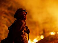 Los Angeles County firefighters, using only hand tools, keep fire from jumping a fire break at the Bobcat Fire in the Angeles National Forest on September 11, 2020 north of Monrovia, California. California wildfires that have already incinerated a record 2.3 million acres this year and are expected to continue till December. The Bobcat Fire has grown to more than 26,000 acres. David McNew/Getty Images/AFP DAVID MCNEW / GETTY IMAGES NORTH AMERICA / Getty Images via AFP