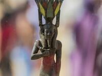 A picture taken on October 3, 2020 shows a statue, excavated by the Egyptian archaeological mission which resulted in the discovery of a deep burial well with more than 59 human coffins closed for more than 2,500 years, displayed during a press conference at the Saqqara necropolis, 30 kms south of the Egyptian capital Cairo. They were unearthed south of Cairo in the sprawling burial ground of Saqqara, the necropolis of the ancient Egyptian capital of Memphis, a UNESCO World Heritage site. Their exteriors ar