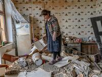 Xatire Celilova walks in the kitchen of her destroyed flat following a ceasefire during a military conflict between Armenia and Azerbaijan over the breakaway region of Nagorno-Karabakh, in the town of Terter, Azerbaijan, on October 10, 2020. Armenia and Azerbaijan traded accusations of new attacks on October 10 in breach of a ceasefire deal to end nearly two weeks of heavy fighting over the disputed Nagorno-Karabakh region. Bulent Kilic / AFP