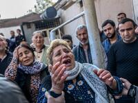 Women react as rescuers search for victims or survivors at the blast site hit by a rocket during the fighting between Armenia and Azerbaijan over the breakaway region of Nagorno-Karabakh, in the city of Ganja, Azerbaijan, on October 11, 2020. Bulent Kilic / AFP