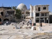Syrian workers take part in the reconstruction of the Hatab Square in the Jdaideh neighbourhood in Aleppo's Old City on October 17, 2020. AFP