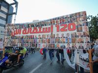 Hundreds marched in Lebanon's capital to mark the first anniversary of a non-sectarian protest movement that has rocked the political elite but has yet to achieve its goal of sweeping reform. ANWAR AMRO / AFP