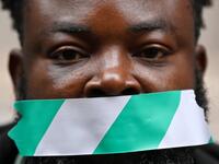 Protestors attend a demonstration outside the Nigerian High Commission against police brutality in Lagos in London on October 21, 2020. UN Secretary General Antonio Guterres called Wednesday for an end to what he called "brutality" by police in Nigeria, which has been rocked by two weeks of protests. Guterres said gunmen that opened fire on peaceful protesters Tuesday evening in Lagos caused "multiple deaths" and many injuries. DANIEL LEAL-OLIVAS / AFP