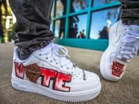 Grammy nominated artist "DaBaby" shows his shoes as he promotes his voter support efforts, "Vote Baby Vote", by hosting an event at a polling location in Charlote, North Carolina, November 3, 2020. The United States started voting Tuesday in an election amounting to a referendum on Donald Trump's uniquely brash and bruising presidency, which Democratic opponent and frontrunner Joe Biden urged Americans to end to restore "our democracy."  Grant Baldwin / AFP