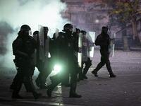 Police officers wearing anti-riot gear charge against protesters during the rally against government’s coronavirus restrictions in Ljubljana on November 5, 2020. Jure Makovec / AFP