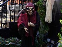 An Upper East Side home is decorated with a Grim Reaper skeleton for Halloween on October 31, 2020 in New York City. Many Halloween events have been canceled or adjusted with additional safety measures due to the ongoing coronavirus (COVID-19) pandemic. Cindy Ord/Getty Images/AFP