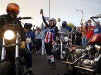 People celebrate the results of the 2020 Presidential election along West Hollywood on November 7, 2020 in Los Angeles, California. Emma McIntyre / GETTY IMAGES NORTH AMERICA / Getty Images via AFP