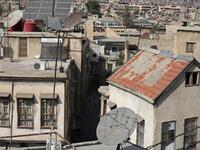 A partial view shows the old part of Syria's capital Damascus on October 28, 2020. The old city of the Syrian capital is famed for its elegant century-old houses, usually two storeys built around a leafy rectangular courtyard with a carved stone fountain at its centre. While the capital has been largely spared the violence of Syria's almost ten-year war, several of these traditional homes have been abandoned by their owners or damaged in the conflict. LOUAI BESHARA / AFP