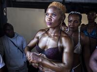 Bodybuilders wait before going on stage during the Iron Fit Bodybuilding competition in Nairobi on December 05, 2020. 130 participants from all across East Africa took part in the second edition of this competition which included categories like Bikini, Figure, Physique and Bodybuilding. Patrick Meinhardt / AFP