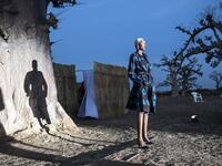 A fashion model poses at the start of the runway during Dakar Fashion Week in Dakar on December 12, 2020. JOHN WESSELS / AFP