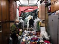 Augusto Grilli works in his " Alfa Theatre" laboratory in Turin, on November 30, 2020. The Grilli family has a collection of more than 20,000 objects from around the world, everything from theatres, marionettes and glove puppets to shadow figures and silhouettes. A long-time dream of Grilli and his wife Mariarosa, 78, the museum is due to open in 2023 in Turin, financed both privately and publicly with the help of different institutions.  Marco Bertorello / AFP