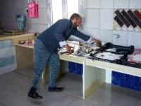Libyan fishmonger Radwan Jibril who uses a prosthetic leg after an injury amid clashes in 2011, works at his shop in the port city of Misrata, on December 17, 2020. With Libya's health sector left in tatters by its multiple conflicts since the 2011 revolution, war-wounded Libyans are often sent abroad for treatment, at the expense of the state. However, A national centre for prostheses, being established in Misrata, already has a patient waiting list of more than 3,000 amputees