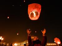 A girl launches a Chinese lantern during New Year celebrations in Yerevan early on January 1, 2021. Karen MINASYAN / AFP