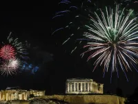 Fireworks explode over the ancient Acropolis in Athens during the new year's celebrations on December 31, 2020. LOUISA GOULIAMAKI / AFP