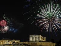 Fireworks explode over the ancient Acropolis in Athens during the new year's celebrations on December 31, 2020. LOUISA GOULIAMAKI / AFP