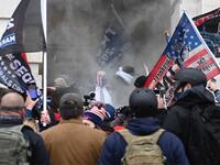 Trump supporters are getting tear gassed outside the US Capitol in Washington, DC on January 6, 2021. Demonstrators breeched security and entered the Capitol as Congress debated the a 2020 presidential election Electoral Vote Certification. ANDREW CABALLERO-REYNOLDS / AFP