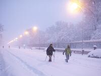People walk amid a heavy snowfall in Madrid on January 9, 2021. Heavy snow fell across much of Spain, leaving huge areas blanketed in white as Storm Filomena brought wintry weather not seen in decades to the Iberian peninsula. Benjamin Cremel / AFP