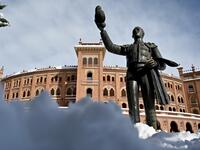 Snow covers the area outside the Las Ventas bullring in Madrid on January 10, 2021. Snowstorms in Spain left three people dead and caused chaos across much of the country, trapping motorists and shutting down the capital's air and rail links. Gabriel BOUYS / AFP