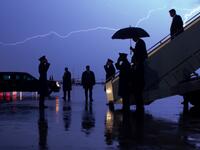 AFP presents a retrospective photo package of 60 pictures marking the 4-year presidency of President Trump. US President Donald Trump disembarks from Air Force One as lightning splits the sky during a storm at Joint Base Andrews in Maryland, August 28, 2020. SAUL LOEB / AFP