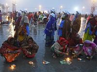 Members of local village panchayat wearing face shields and masks inspect the sanitization on the beach as a preventive measure against the Covid-19 coronavirus as Hindu pilgrims perform rituals at the confluence of Ganges and the Bay of Bengal during the Gangasagar Mela on the occasion of Makar Sankranti, a day considered to be of great religious significance in Hindu mythology, at Sagar Island, around 150 kms south of Kolkata on January 14, 2021. Dibyangshu SARKAR / AFP