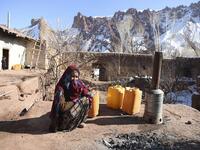 In this photo taken on January 6, 2021, a Hazara woman Jawahir Sedaqat, who lost two sons in an explosions on November 24 last year in the city of Bamiyan, sits in the courtyard of her house in the Somarah village on the outskirts of Bamiyan province. Comprising roughly 10 to 20 percent of Afghanistan's 38-million population, Hazaras have long been persecuted for their largely Shiite faith by Sunni hardliners in a country wracked by deep ethnic divisions. WAKIL KOHSAR / AFP