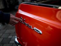 This picture taken on January 16, 2021 shows the side emblem of a 1964 El Camino Chevrolet during a gathering of auto enthusiasts in Tokyo. A loose club of fans rolls up most weekends in central Tokyo to show off their Cadillacs, Chevrolets and other modern classic vehicles from the mid to late 20th century. Philip FONG / AFP