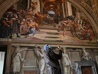 People visit one of Raphael's Rooms in the Vatican Museum, on its reopening day to the public on February 1, 2021 in Vatican City, as the city-state eases its closure aimed at curbing the spread of the COVID-19 infection, caused by the new coronavirus. Andreas SOLARO / AFP