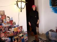 Jordanian make-up artist Alaa Bliha, 27, enters her room in the basement apartment where she lives with her mother and young brother in the capital Amman, on February 2, 2021. Bliha has beaten the lockdown blues and shot to online fame with videos of herself imitating famous figures from across the Arab world and beyond. From Donald Trump and Queen Elizabeth II to Egyptian superstars like singer Umm Kalthum and actor Adel Imam, her characters have made Alaa Bliha a star in her own right, with tens of thousa