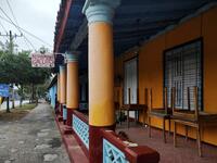 A man walks by a closed private restaurant in Vinales, Cuba, on January 28, 2021. At the foot of the majestic rock formations of Vinales, the terraces of the restaurants look empty and the lodgings have closed. With the arrival of COVID-19, the incipient prosperity of this Cuban town came to a halt and people abandoned tourism jobs to return to work the land. YAMIL LAGE / AFP