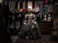 A reveller poses with a traditional carnival costume in 'La Bauta' shop in Venice on February 6, 2021, as the traditional Venice carnival is being cancelled due to the Covid-19 pandemic. Marco Bertorello / AFP