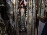 A reveller poses with a traditional carnival costume in 'La Bauta' shop in Venice on February 6, 2021, as the traditional Venice carnival is being cancelled due to the Covid-19 pandemic. Marco Bertorello / AFP
