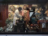 Mask artisan Hamid Seddighi sets a traditional carnival costume in the shop window of his shop and laboratory 'Ca del Sol' in Venice on February 6, 2021, as the traditional Venice carnival is being cancelled due to the Covid-19 pandemic. Marco Bertorello / AFP